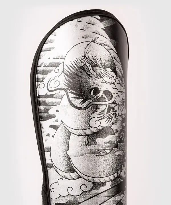 Shin guards for children Venum YKZ21 Shin Guards For Kids Black White photo