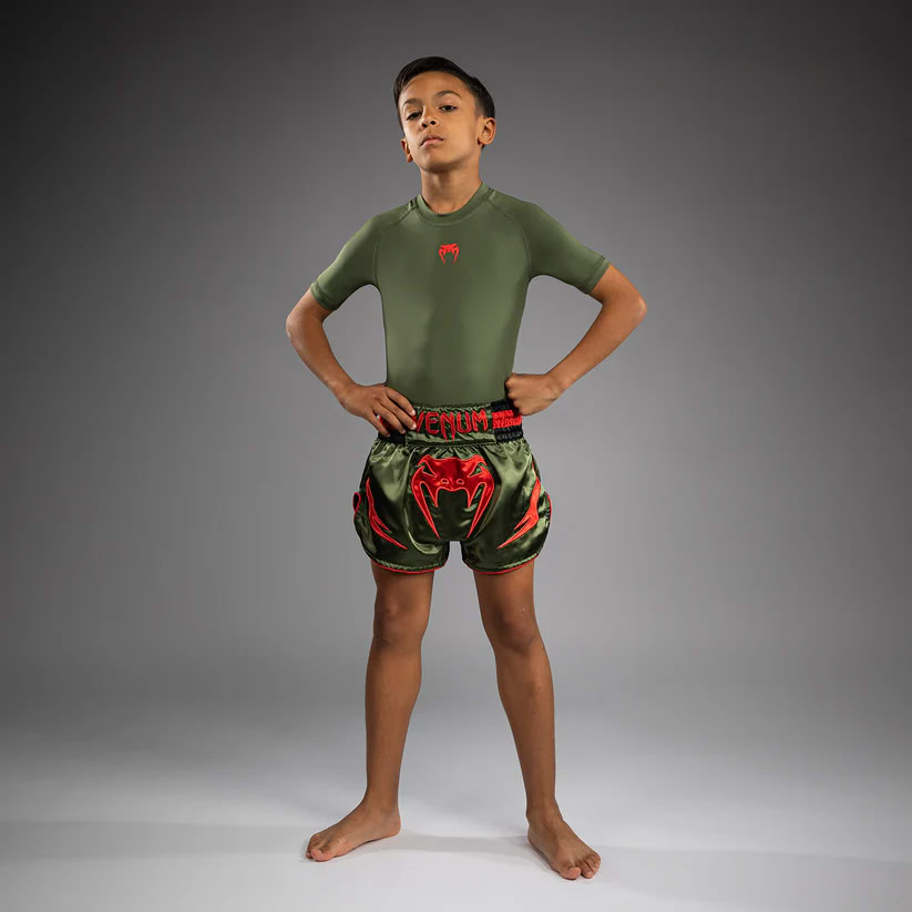 Дитячі шорти Venum Inferno Kids Muay Thai Shorts Army Green Orange фото