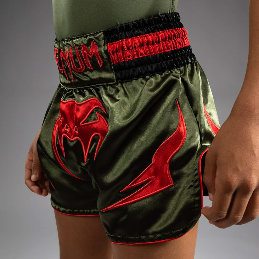 Дитячі шорти Venum Inferno Kids Muay Thai Shorts Army Green Orange де купити
